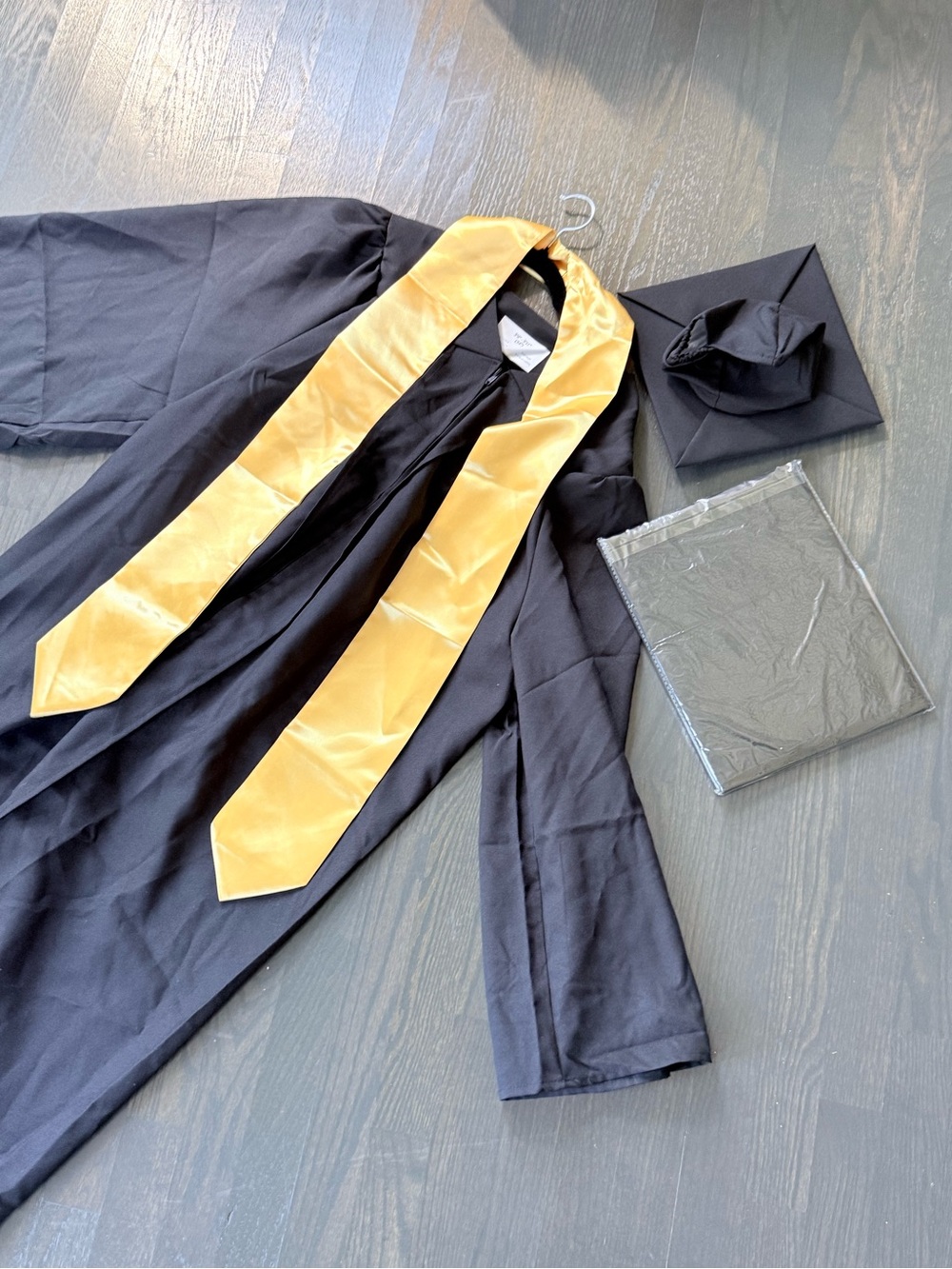 Black Graduation Gown with Gold Stole and Cap
